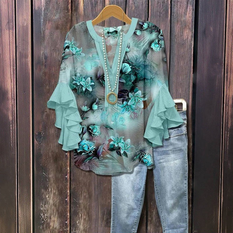 Florina™ - Blus med Blommönster, Volangärmar och Feminint Snitt